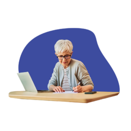 Older woman with laptop at a desk