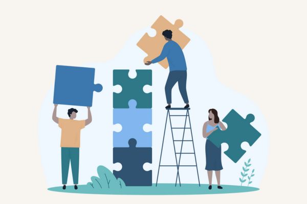 Illustration of a team building a puzzle