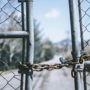 A gate locked with a padlock